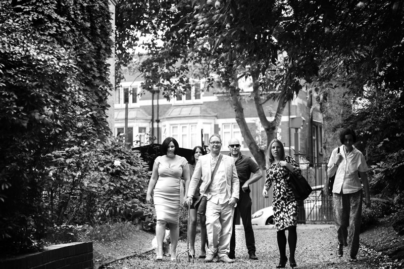 Wedding party arriving at Rosslyn Hill Chapel by London reportage wedding photographer James Robertshaw