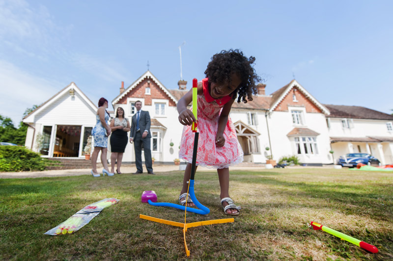 Child with stomp rocket at Leeford place wedding by Sussex wedding photographer James Robertshaw