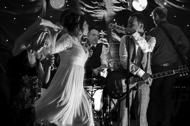 Bride dancing at Leeford place wedding by Sussex wedding photographer James Robertshaw