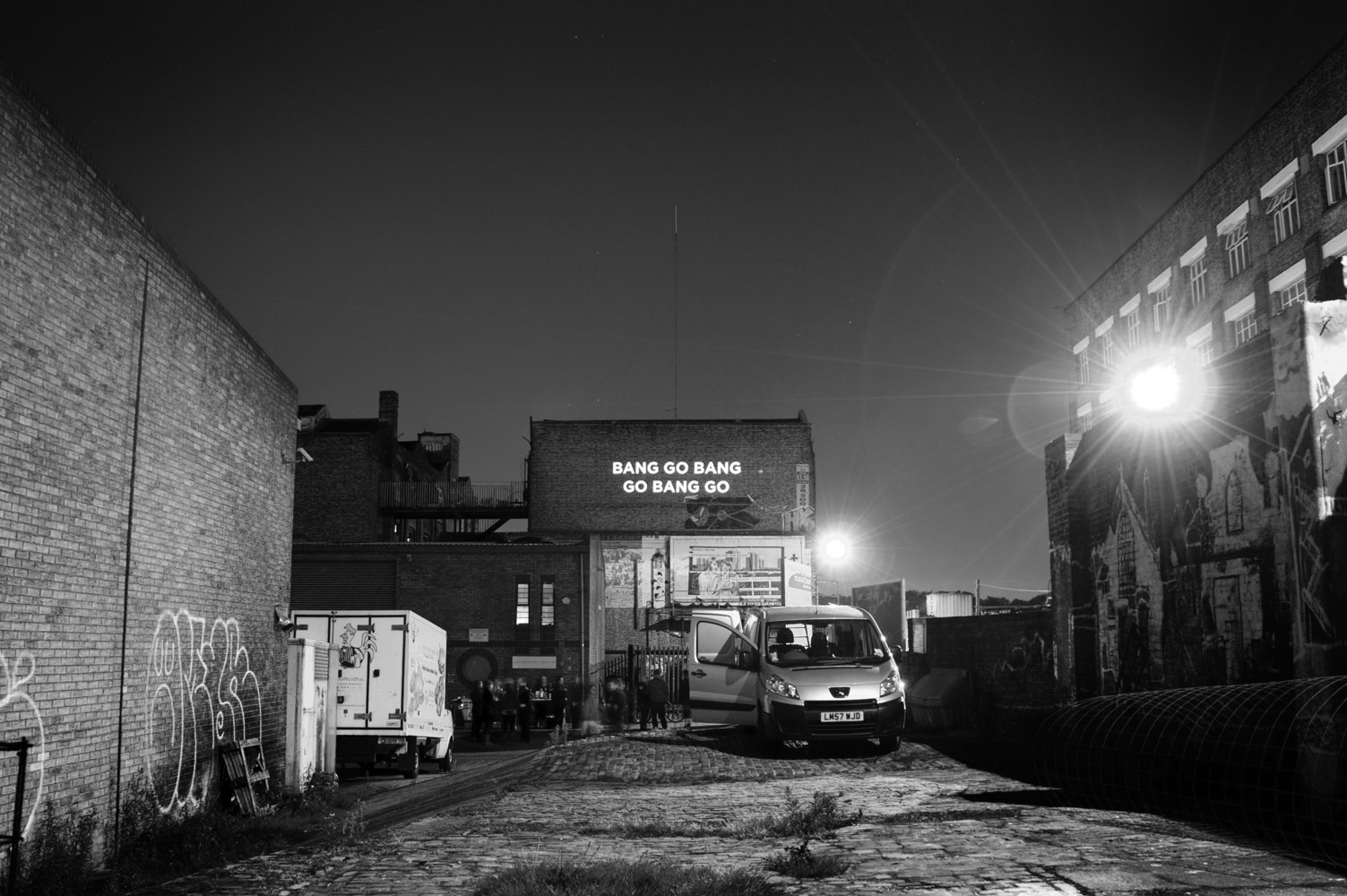 Song lyrics projected on the side of a building photographed by James Robertshaw