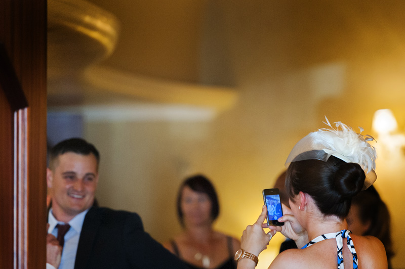 Wedding guests taking phone pics at The Grand Eastbourne wedding by Sussex wedding photographer James Robertshaw