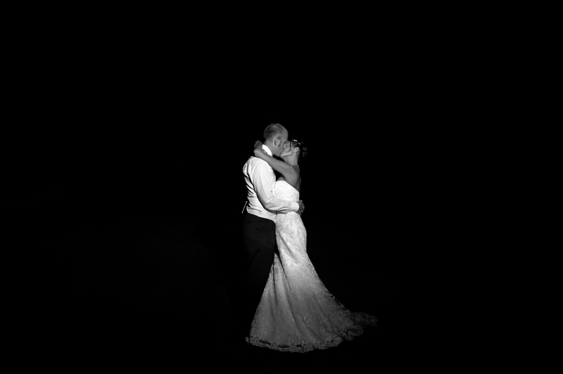 Couple kiss at Cooden Beach Hotel wedding reception by Sussex wedding photographer James Robertshaw
