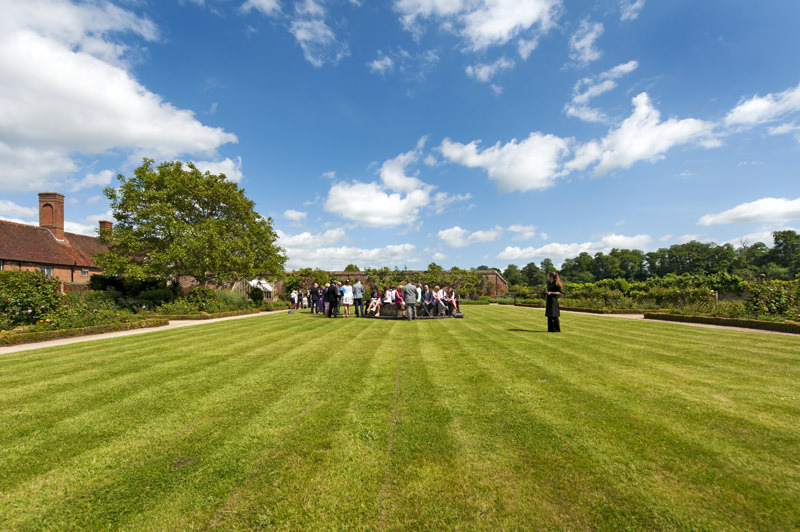 Wedding party on the lawn at The Walled Garden Cowdray