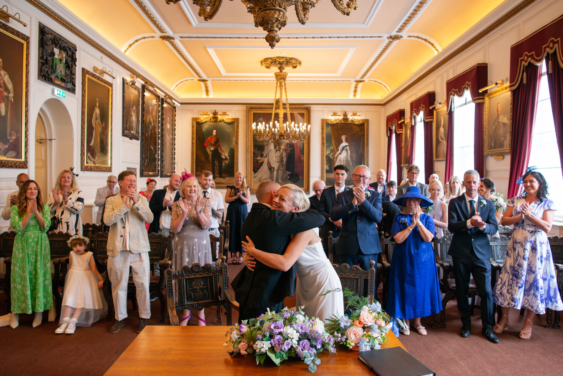 Bride and Grrom embrace at Windsor Town Hall wedding by Windsor Guildhall wedding photogrpaher James Robertshaw