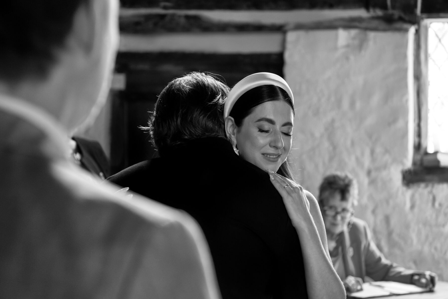 Couple embracing during wedding ceremony at The Pilgrim's Rest