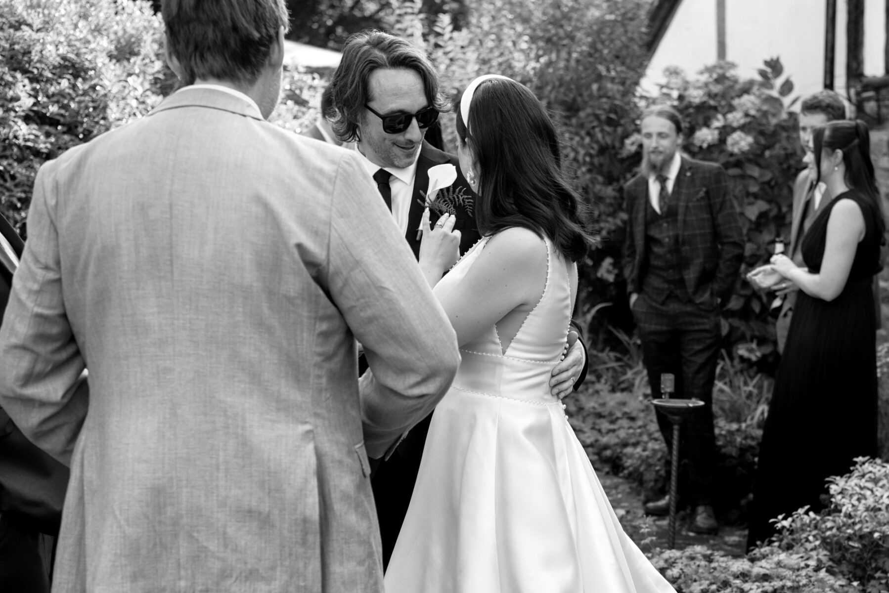 Bride and groom showing rings naturally 