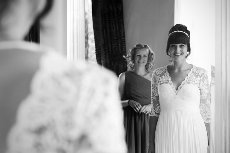 Bride in mirror at Leeford place by Sussex wedding photographer James Robertshaw