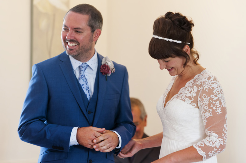  Couple laughing during ceremony at Leeford place wedding by Sussex wedding photographer James Robertshaw