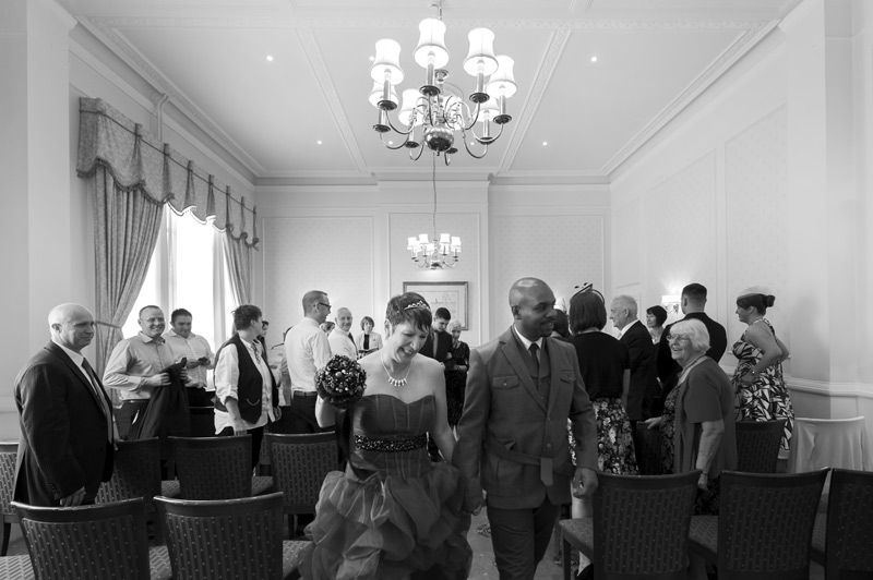 Couple leaving ceremony at The Grand Eastbourne wedding by Sussex wedding photographer James Robertshaw