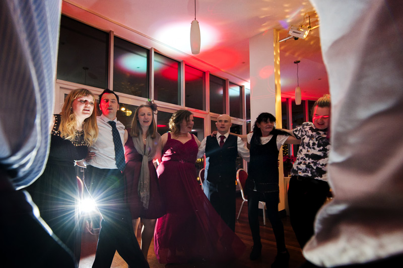 Wedding guests dancing in a circle