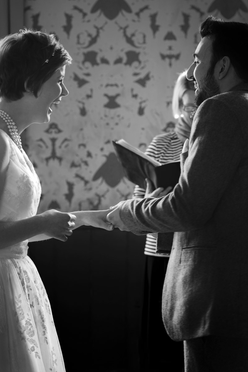 Exchanging rings at the Bell Ticehurst wedding by Sussex Wedding photographer James Robertshaw