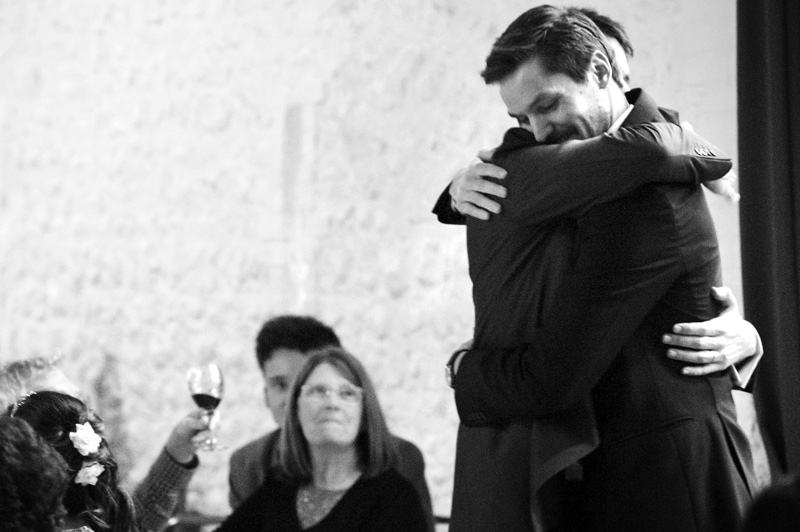 Best man hugging groom at Field place wedding