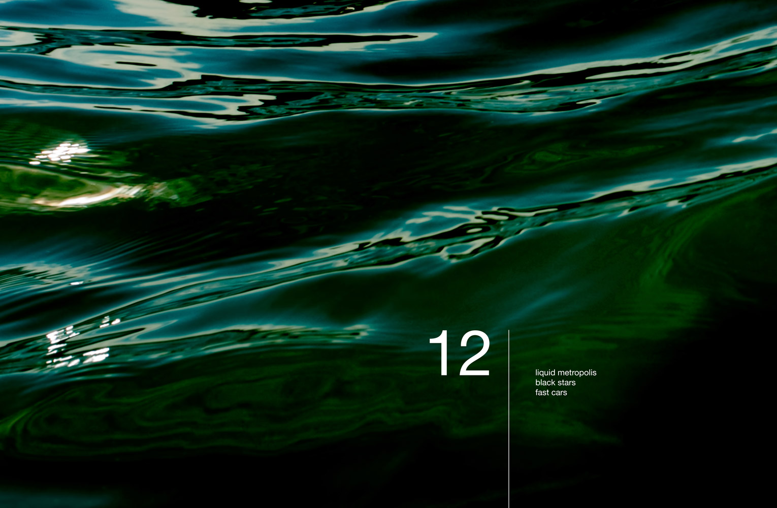 Abstract seascape with text: 12 liquid metropolis black stars fast cars
