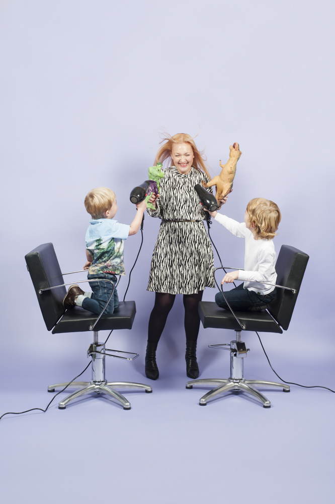 Portrait of hairsylist with children