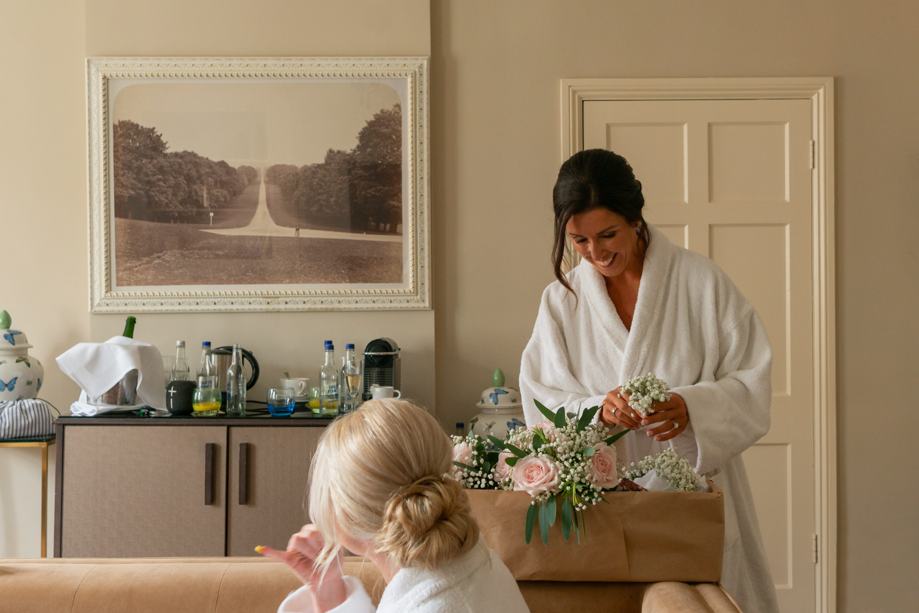 Bridal flowers with Bride and bridesmaid in hotel room