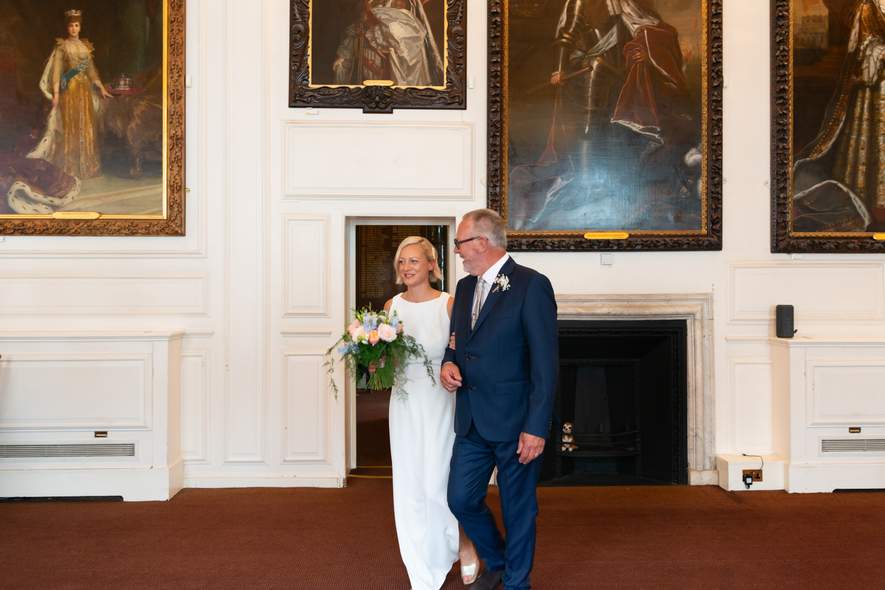 Bride and father entering by Windsor Guildhall wedding photogrpaher James Robertshaw