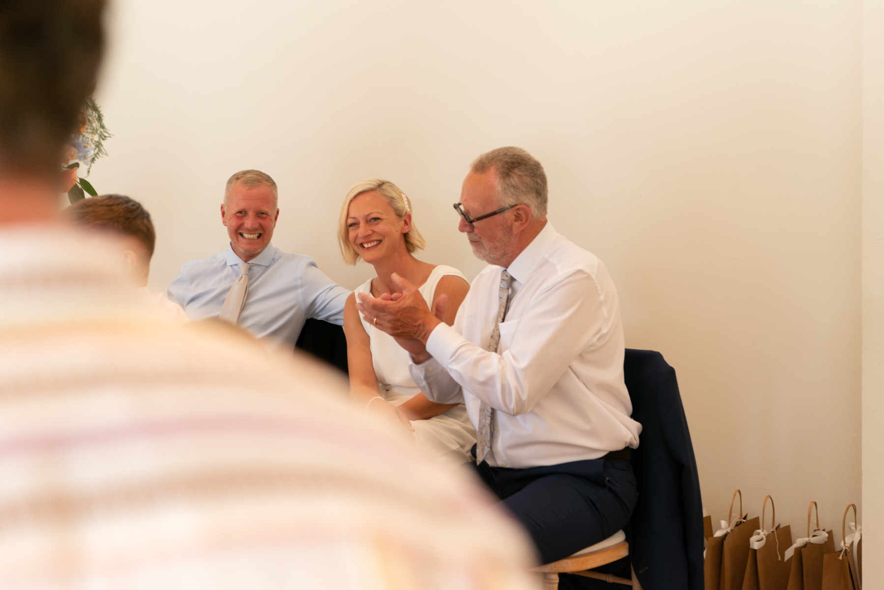 Father of the bride and couple during speeches at Dourney Court wedding