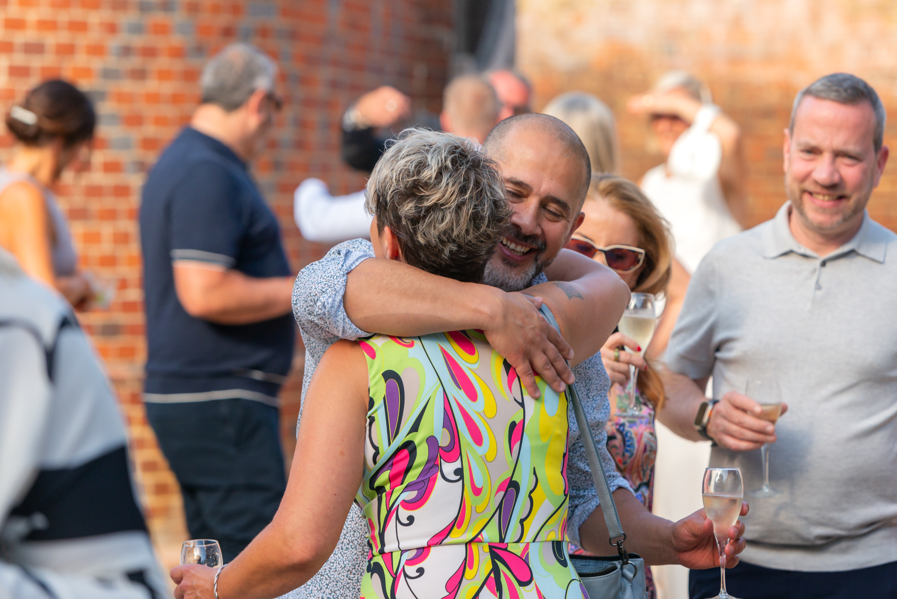 Guests embracing at Dourney Court wedding reception