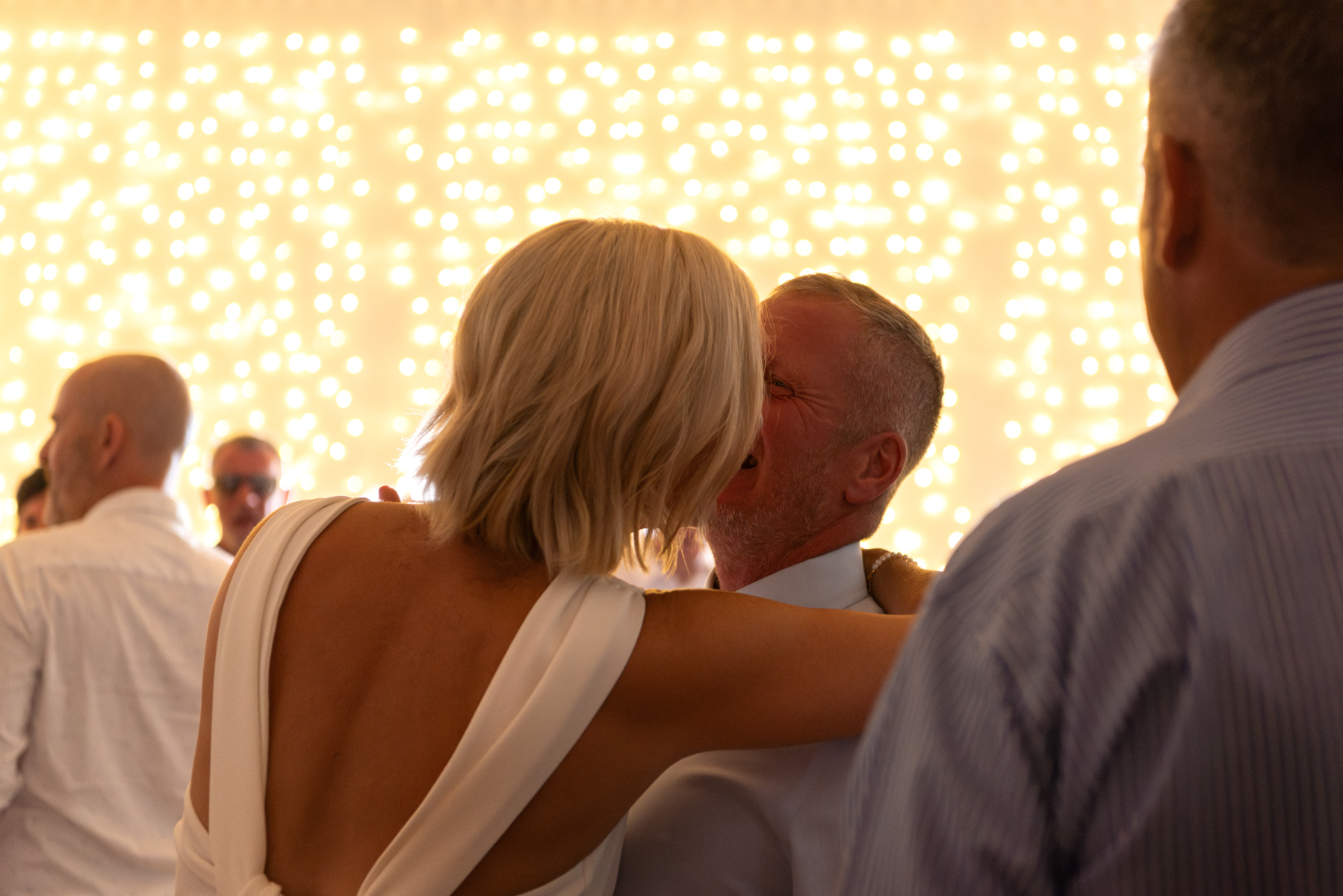 Newlyweds embracing on dancefloor by Windsor Guildhall wedding photographer James Robertshaw