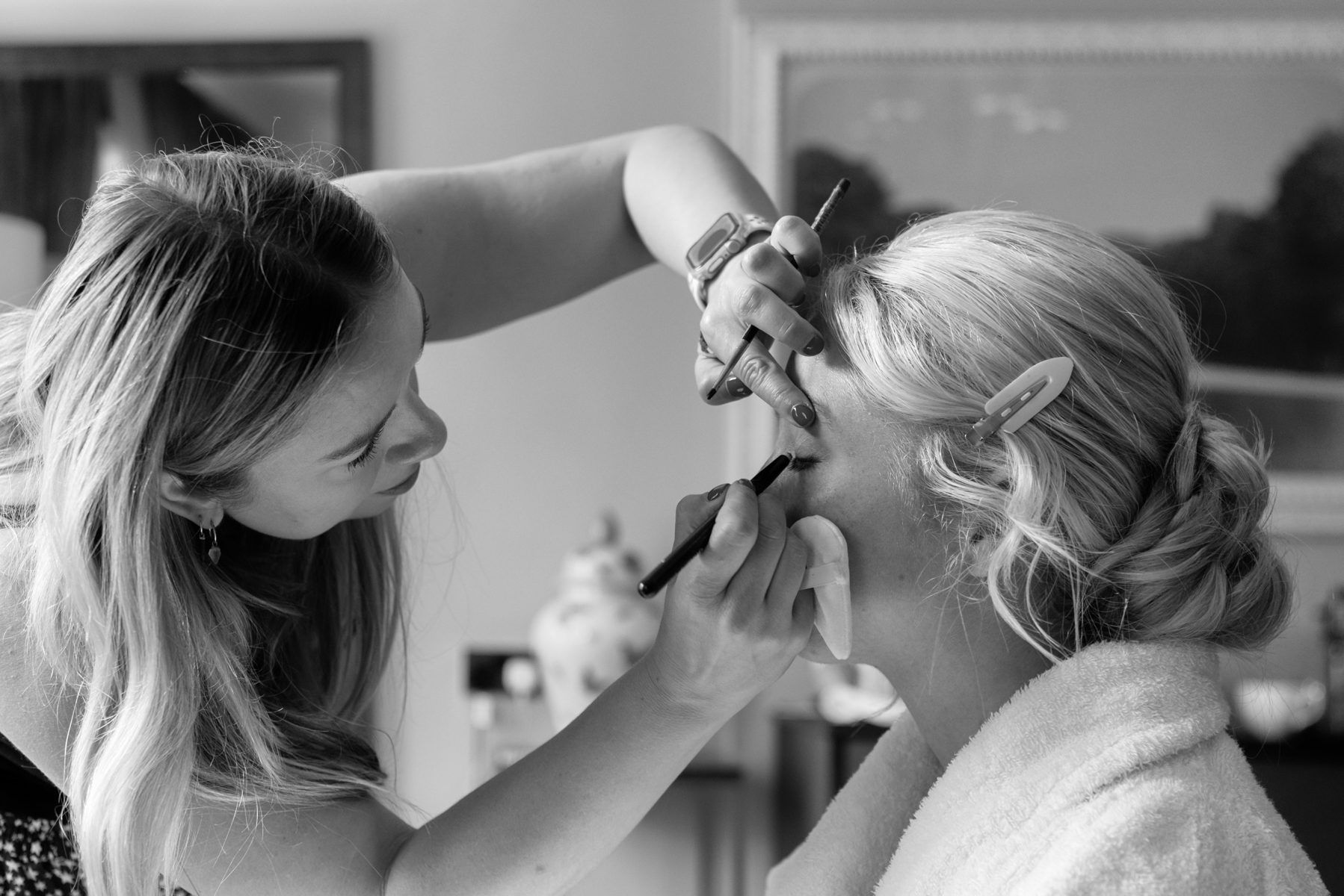 Bridesmaid having make up done